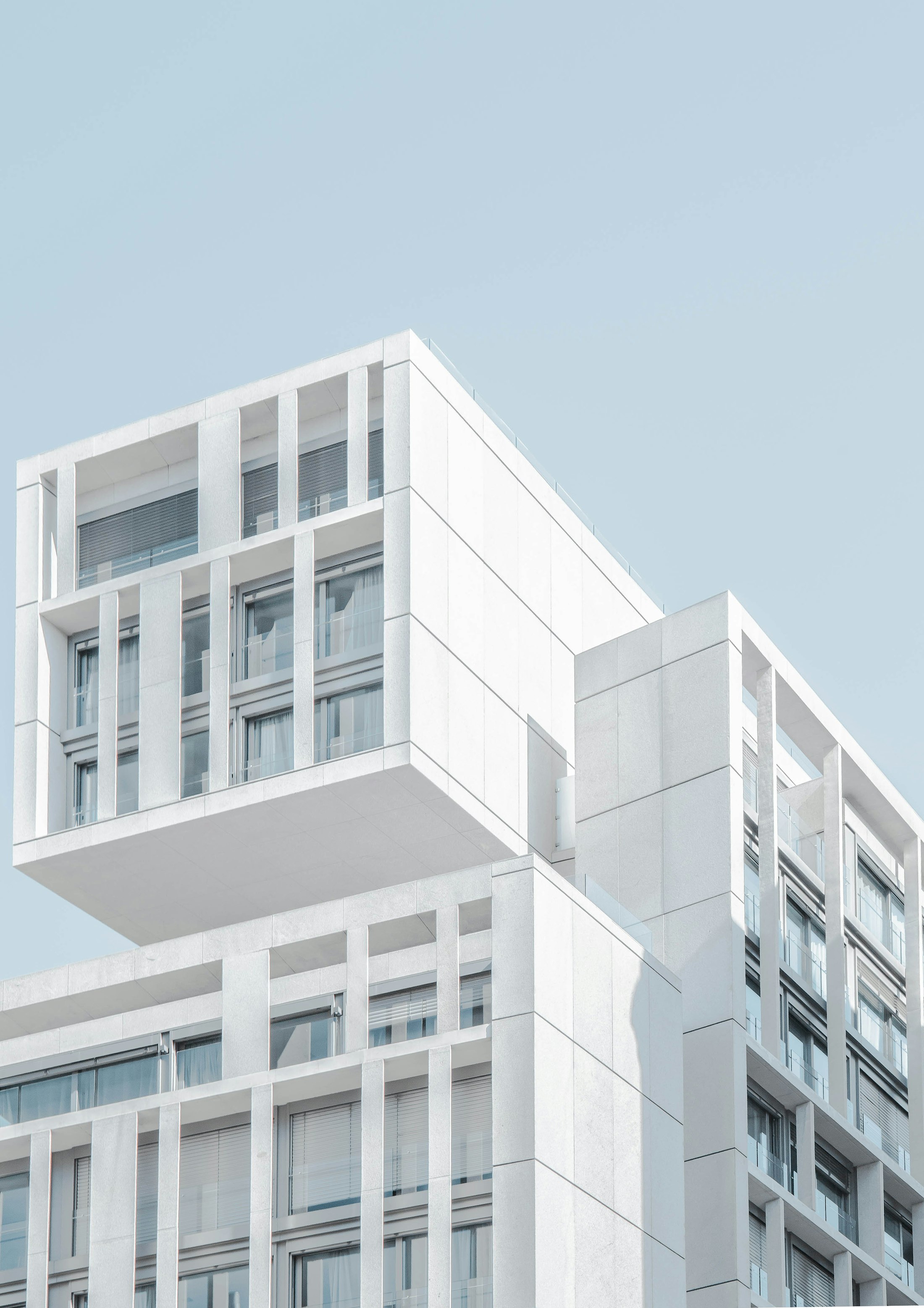 Modern architectural facade against an open sky